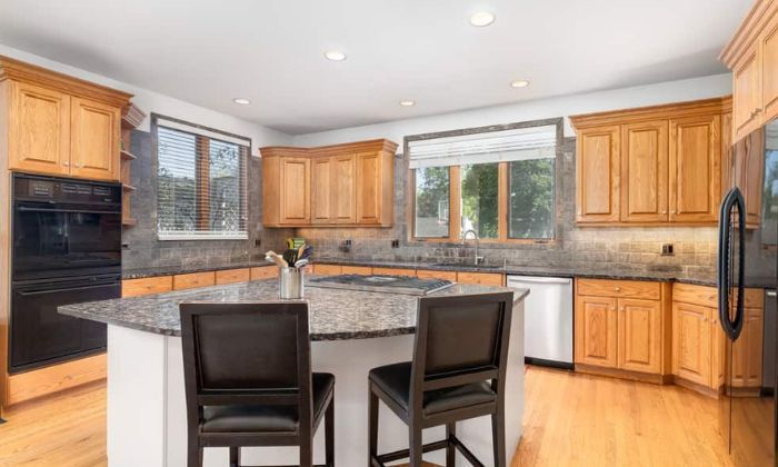 White Countertops with Light Wood Cabinets